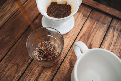 Barista dripping coffee and slow coffee bar style