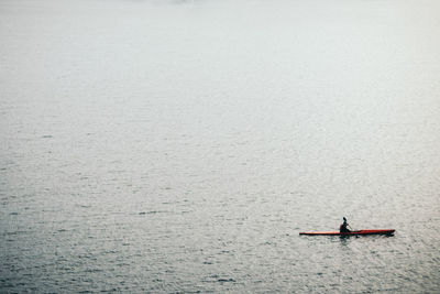 High angle view of woman kayaking on sea