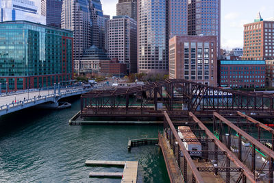High angle view of bridge over river against buildings in city
