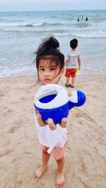 Portrait of boy playing at beach