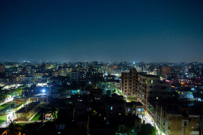 Aerial view of illuminated city at night