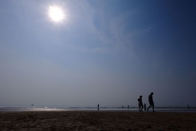 Silhouette of people on beach