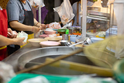 People working at market stall