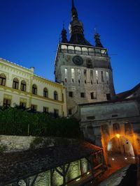 Low angle view of illuminated building against clear sky