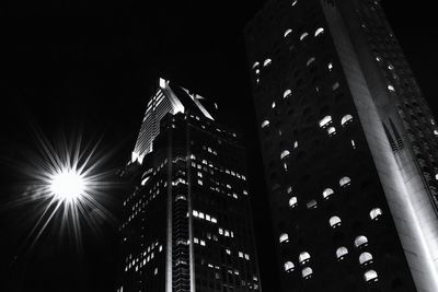 Low angle view of illuminated lights at night