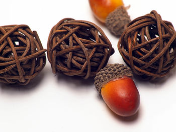 Close-up of fruits on table against white background