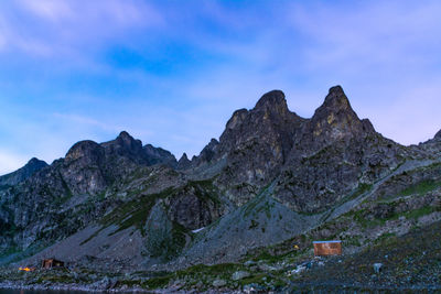 Scenic view of mountain against blue sky