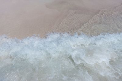 High angle view of surf on beach