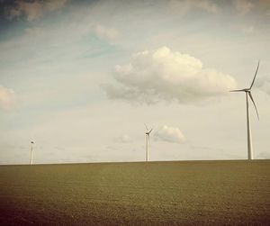 Wind turbines in field