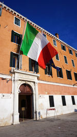 Italian flag on building in city