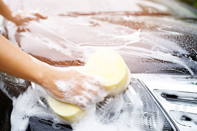 Cropped hand washing hands