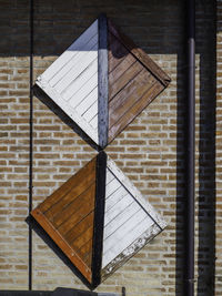 Close-up of umbrella on wall of building