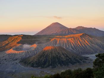 Scenic view of mountain range against sky during sunset
