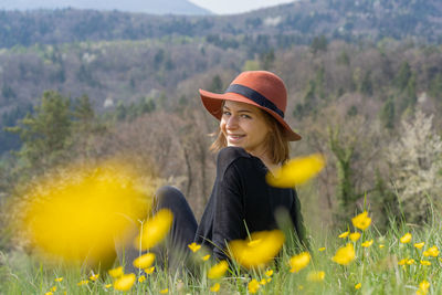 Side view of woman standing on field