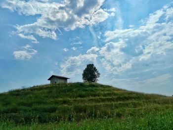 House on field against sky