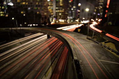 High angle view of light trails on highway at night