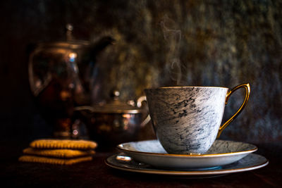 Close-up of coffee cup on table