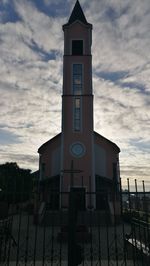 Low angle view of clock tower against sky