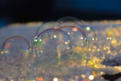 Close-up of bubbles in water at night