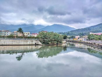 Scenic view of lake and mountains against sky