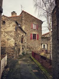 Footpath amidst buildings in town