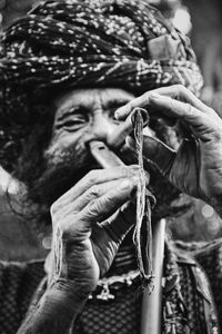 Close-up of man holding rope
