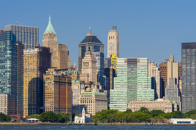 Skyscrapers in city against clear sky