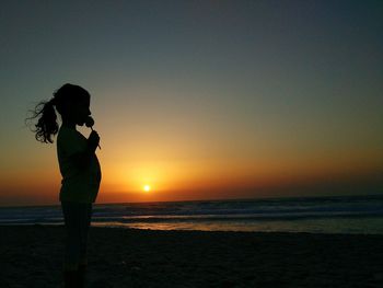 Scenic view of sea at sunset