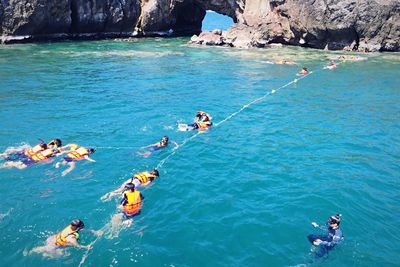 High angle view of people on sea