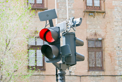 Fire hydrant against red wall