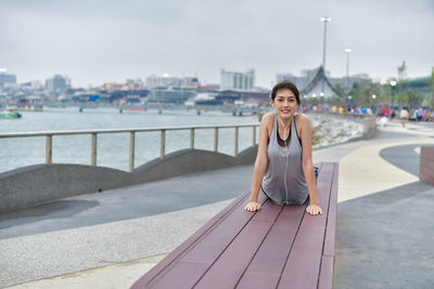 Portrait of smiling woman in city