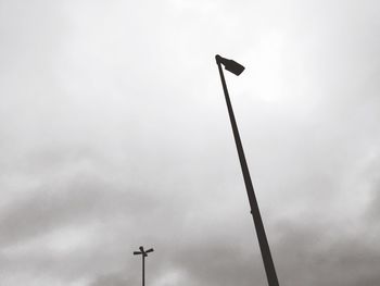 Low angle view of communications tower against sky