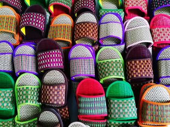 Full frame shot of multi colored straw footwear at market stall for sale