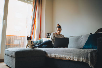 Man relaxing on sofa at home