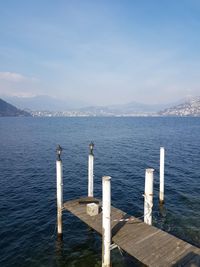 Pier over sea against sky