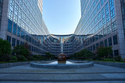 Modern buildings in city against sky