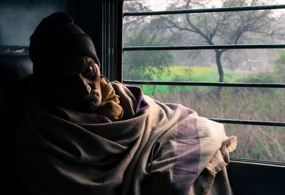 Close-up of man in window