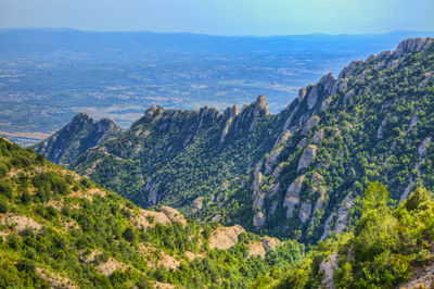 Scenic view of mountains and sea against sky