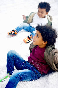 Portrait of young boys sitting on salt