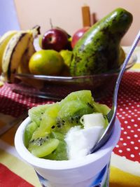 Close-up of fruits in plate on table