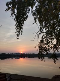 Scenic view of lake against sky during sunset