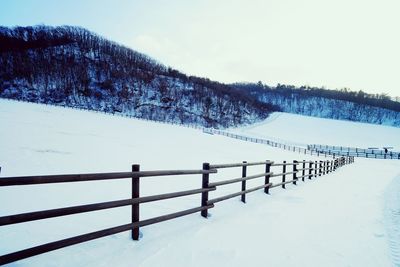 Scenic view of snow covered mountain against sky