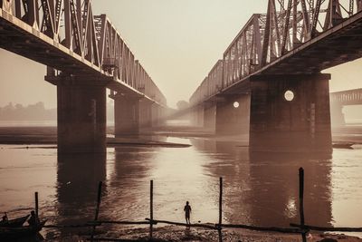 Silhouette of bridge at sunset