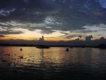 Scenic view of sea against cloudy sky