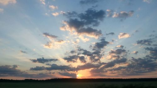 Scenic view of landscape against sky during sunset