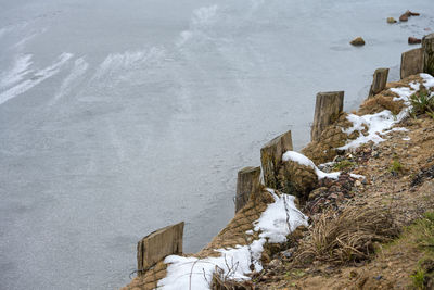 High angle view of snow covered wood during winter