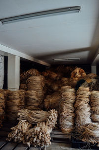 Stack of firewood for sale at market stall