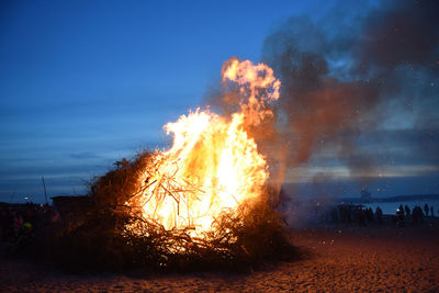 Bonfire at beach during dusk