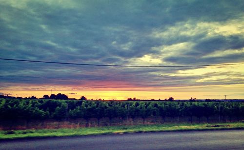 Scenic view of landscape against cloudy sky