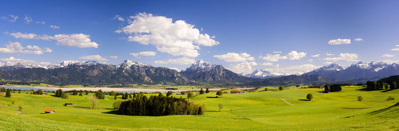 Wide angle landscape in bavaria with alps mountain range at springtime